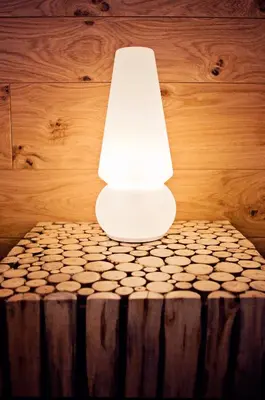a white lamp sitting on top of a table at Penzion Repnik in Kamnik