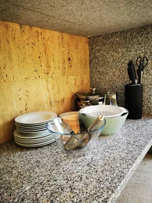 a counter top with plates and bowls on it at Krasen Kras 104 resort in Komen