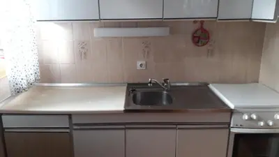 a kitchen with a sink and a counter top at Kralj Matjaž - the green escape under Alps in Golnik