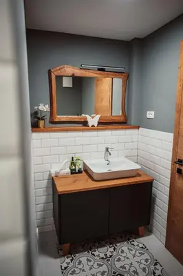 a bathroom with a sink and a mirror at Kocbek since 1929 in Sveti Jurij ob Ščavnici