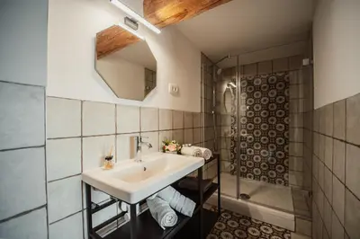 a bathroom with a sink and a shower at Kocbek since 1929 in Sveti Jurij ob Ščavnici