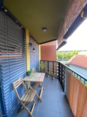 a patio with two chairs and a table on a balcony at Apartma Felicija in Ljubljana