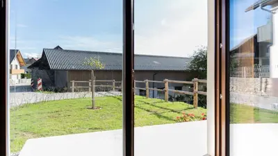 a view of a yard from a window at Vila Vrba in Žirovnica