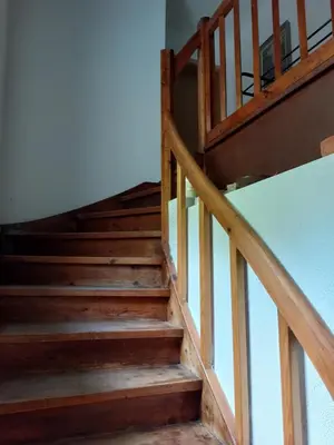 a staircase in a house with wooden steps at Apartma Sava-Stol in Jesenice