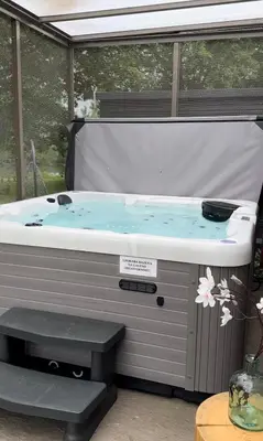a jacuzzi tub sitting inside at MAGNOLIA HOUSE by the RIVER XL in Metlika