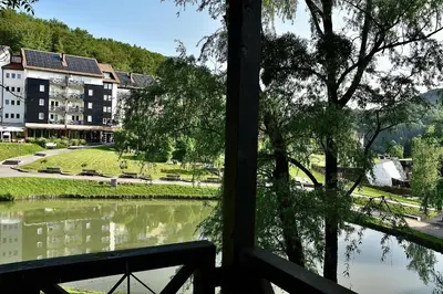 a view of a river from a window at Olimian Oasis Village Lipa 107 in Podčetrtek