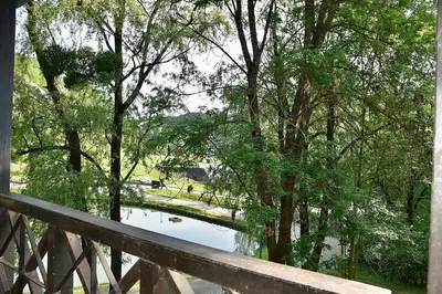 a view of a river from a wooden bridge at Olimian Oasis Village Lipa 107 in Podčetrtek