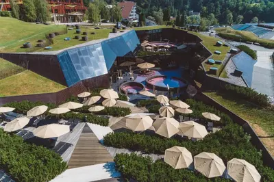 an aerial view of a resort with a pool and umbrellas at Olimian Oasis Village Lipa 107 in Podčetrtek