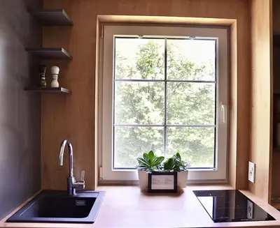 a kitchen with a sink and a window at Olimian Oasis Village Lipa 107 in Podčetrtek