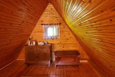 a room with a stove in a wooden cabin at Emerald Bell Cottage - Smaragdni Zvonček in Gomilsko