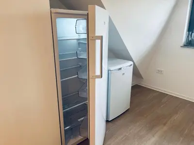 a refrigerator with its door open in a room at Villa Kovačeva 15, app 2, free parking in Ljubljana