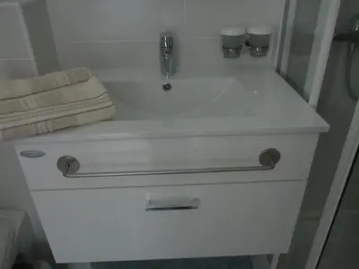 a white sink with a faucet and a towel at Villa Tollazzi in Logatec