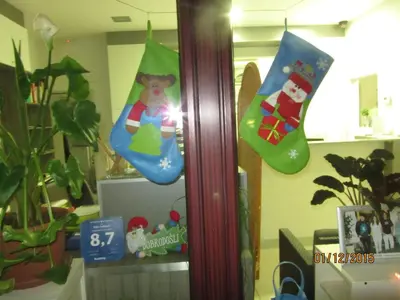a pair of christmas socks hanging on a wall at Villa Tollazzi in Logatec