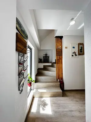 a hallway with a staircase in a house at Slovenian House Vida in Bled