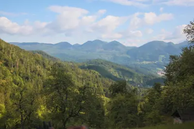 a view of a valley with mountains in the distance at Apartma Gorski razgled in Srednja Vas v Bohinju