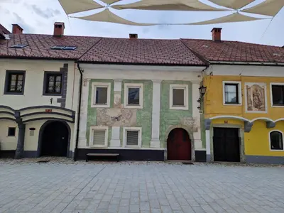 a building with a painting on the side of it at Studio Lotrist in Radovljica