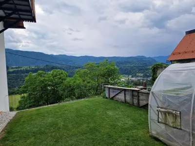 a tent on the roof of a house with a view at Studio Lotrist in Radovljica