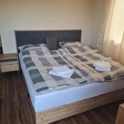 a bed with two towels on top of it at Soba pri nam in Gačnik