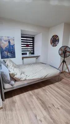 a bedroom with a bed and a window at Apartma Rešer in Črna na Koroškem