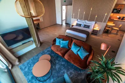 an aerial view of a bedroom with a bed and a couch at Studio na Stolbi in Ljubljana
