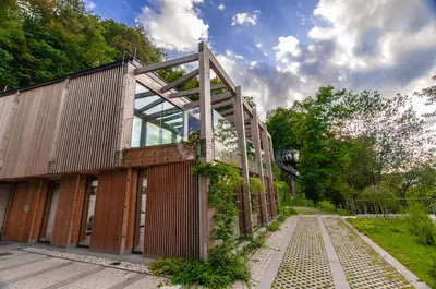an old building with glass doors and a pathway at Studio na Stolbi in Ljubljana