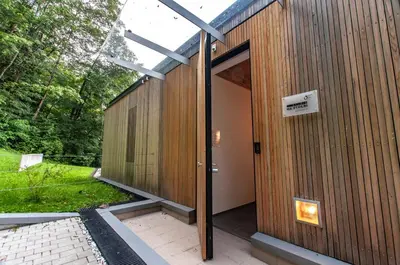 a building with a glass door on the side of it at Studio na Stolbi in Ljubljana