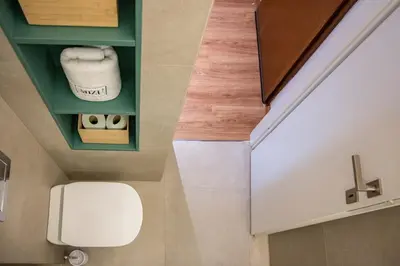 a bathroom with a white toilet in a room at MIZU APARTMA VAS LIPA OLIMJE in Podčetrtek