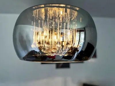 a chandelier with many lights in a room at Nina's Place in Bled