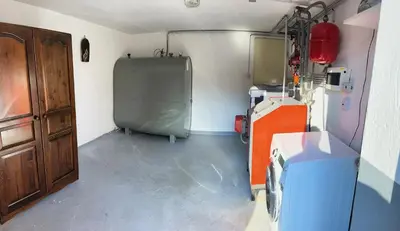 a small room with a refrigerator in a room at Nina's Place in Bled