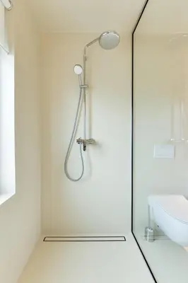 a white bathroom with a shower and a sink at Modern holiday home with terrace close to Nova Gorica in Miren