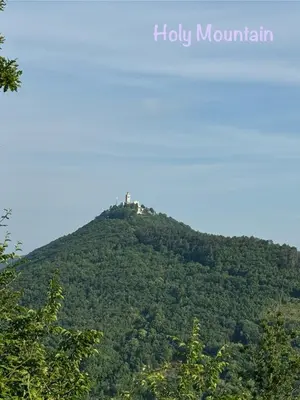 a hill with a house on top of it at Pri Piskovih in Grgar