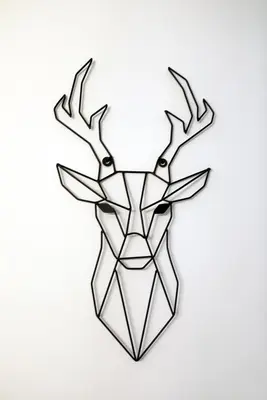 a geometric deer head with antlers on a white background at Esti’s Oasis in Ljubljana