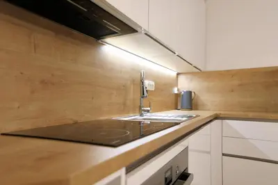 a kitchen with a sink and a counter top at Esti’s Oasis in Ljubljana