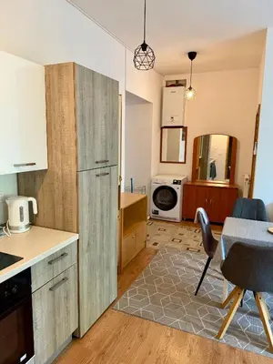 a kitchen with a table and a dining room at Lorume in Postojna