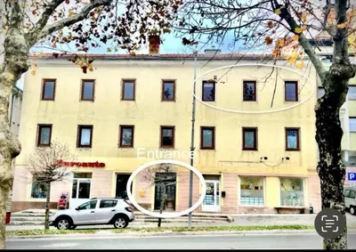 a building with a car parked in front of it at Lorume in Postojna