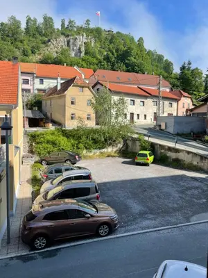 a group of cars parked in a parking lot at Lorume in Postojna