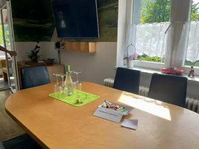 a dining room table with glasses on top of it at Apartma Zeus in Jesenice