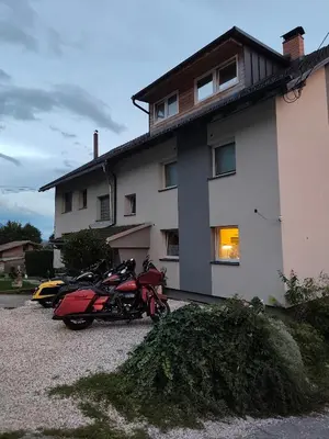 a group of motorcycles parked in front of a building at Apartma Zeus in Jesenice