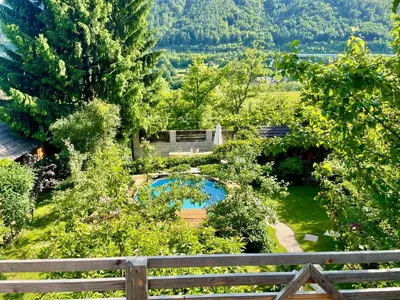 an aerial view of a garden with a fence at Apartma Zeus in Jesenice