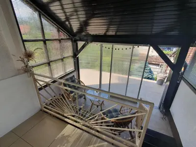 a view of a room with a balcony with windows at Apartment Sonata in Kamnik