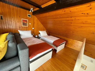 a room with two beds in a sauna at Apartment Sonata in Kamnik
