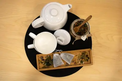 a plate with a tea pot and a tray of food at Jane's Place, experience the atmosphere of a historic villa & free parking in Ljubljana
