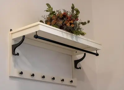 a shelf with a potted plant on top of it at Jane's Place, experience the atmosphere of a historic villa & free parking in Ljubljana