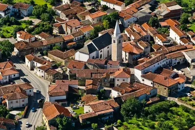 an aerial view of a town with roofs at Guest House Žerjal in Podnanos