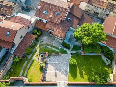 an overhead view of a house with a yard at Guest House Žerjal in Podnanos