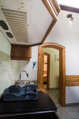 a kitchen with a sink and a counter top at Estate Žagmeštri in Ljubno