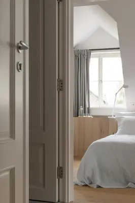 a bedroom with a bed and a window at April1550 Boutique Hotel in Ljubljana