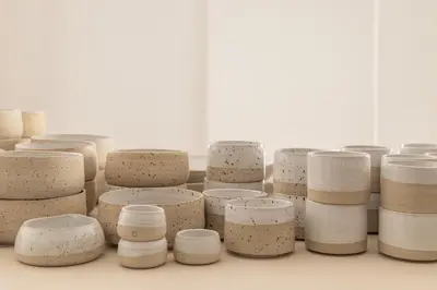 a bunch of different pots sitting on a table at April1550 Boutique Hotel in Ljubljana