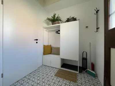 a room with a white cabinet with plants on it at Spa House Alenka Terme Čatež in Čatež ob Savi
