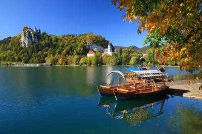 a boat sitting in the middle of a lake at Mia Dream in Bled